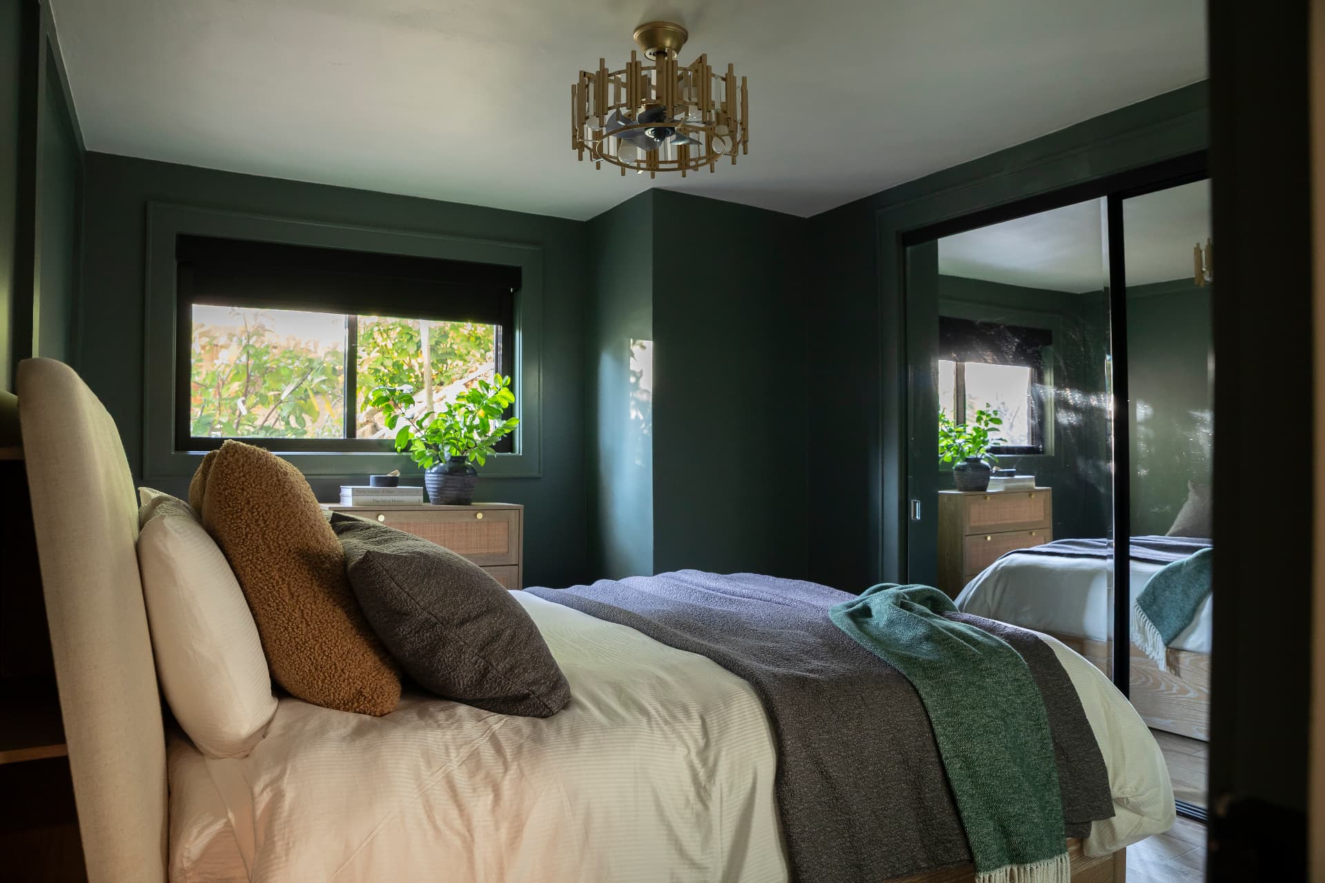 Guest bedroom with deep green walls